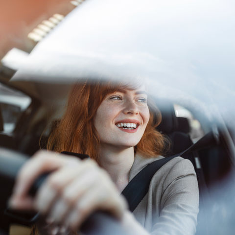 Woman driving an electric car